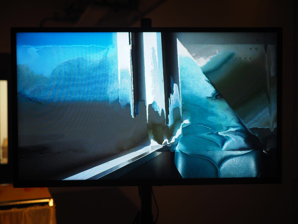 monitor screen with an abstracted image of a ferry seat