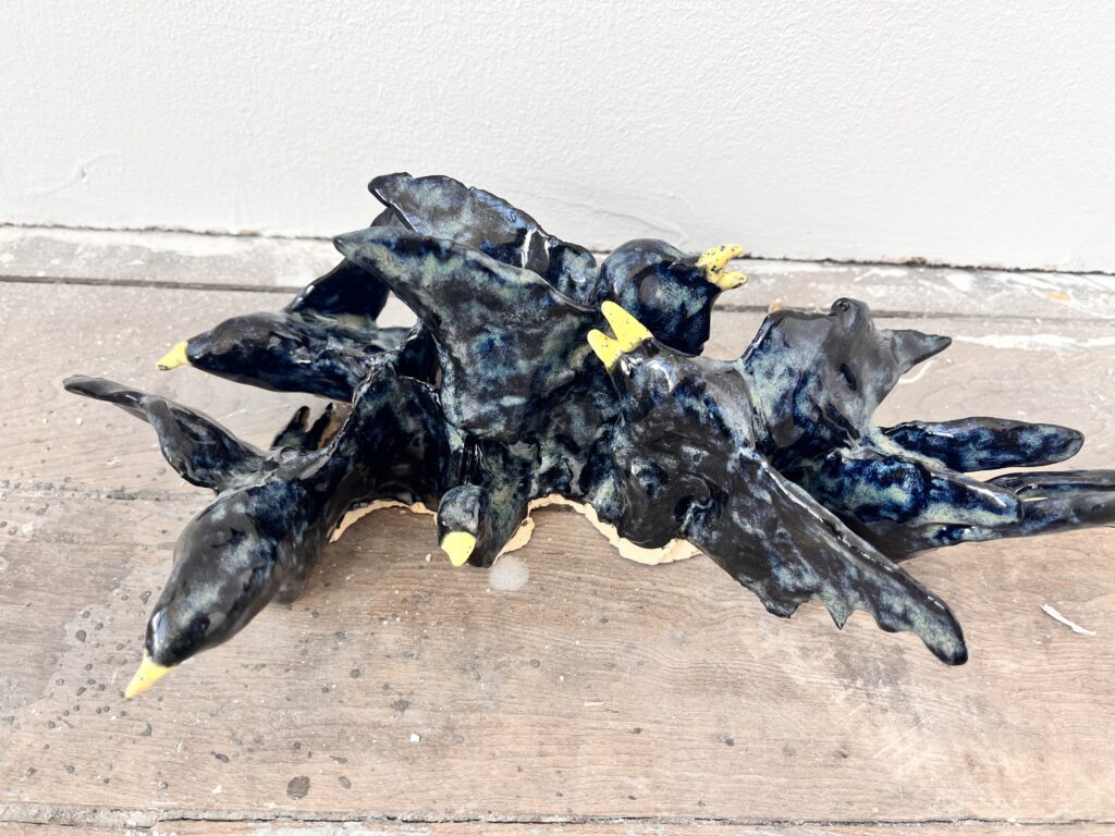 Flock of birds in stoneware ceramics